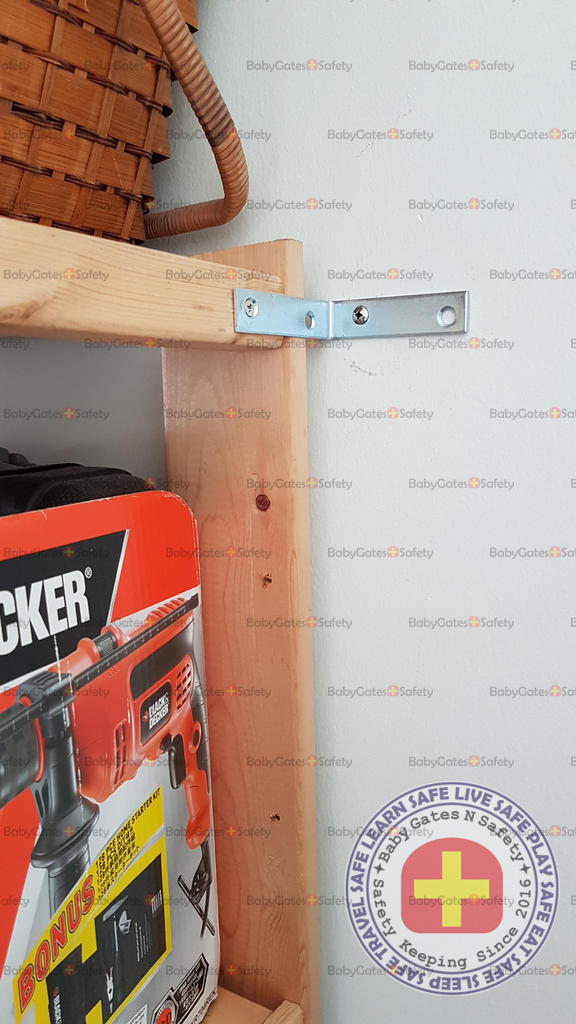 Metal bracket secures shelf to wall