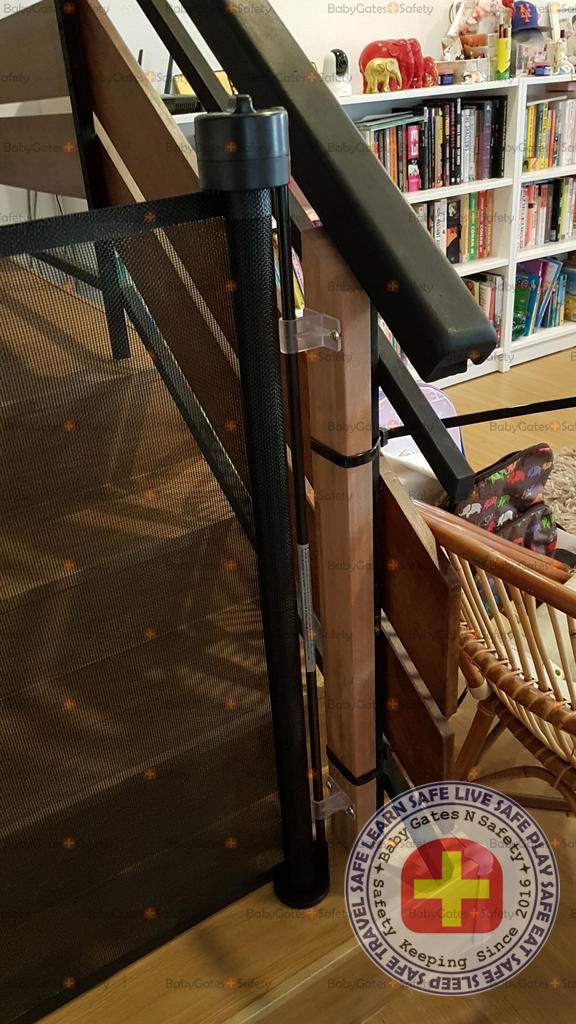 Custom wooden pillar cable tied to metal railing