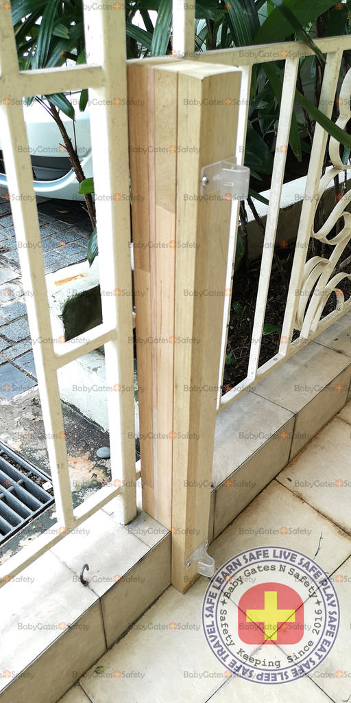 Custom wooden pillar created to fit metal railing