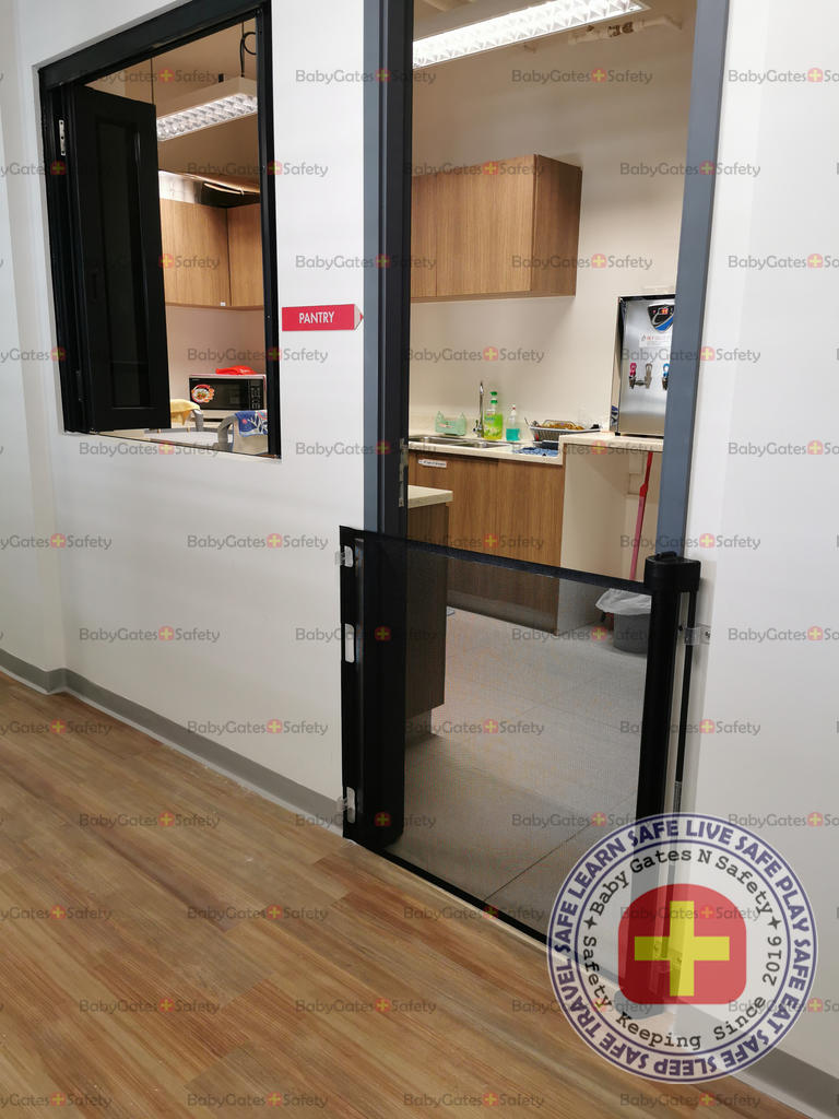 Smart Retract retractable gate used to prevent access to childcare pantry