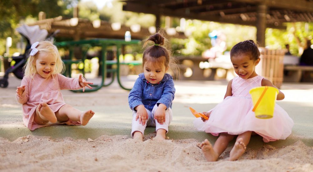 toddler-trio-playing-with-sand